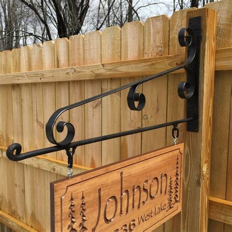 hanging metal sign brackets|wrought iron sign post.